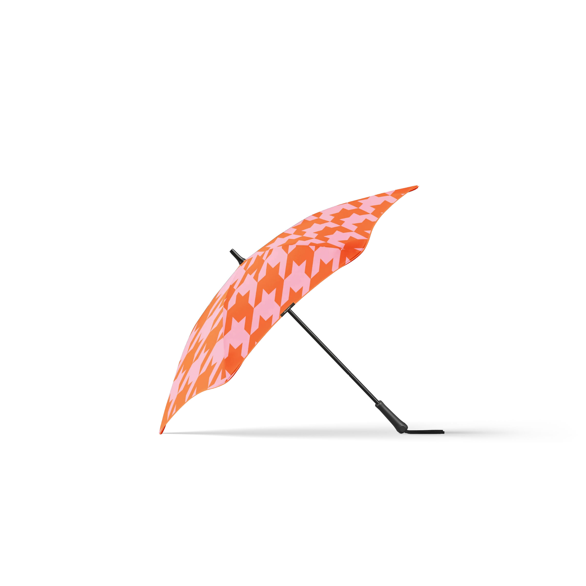 Orange and pink patterned umbrella on a white background