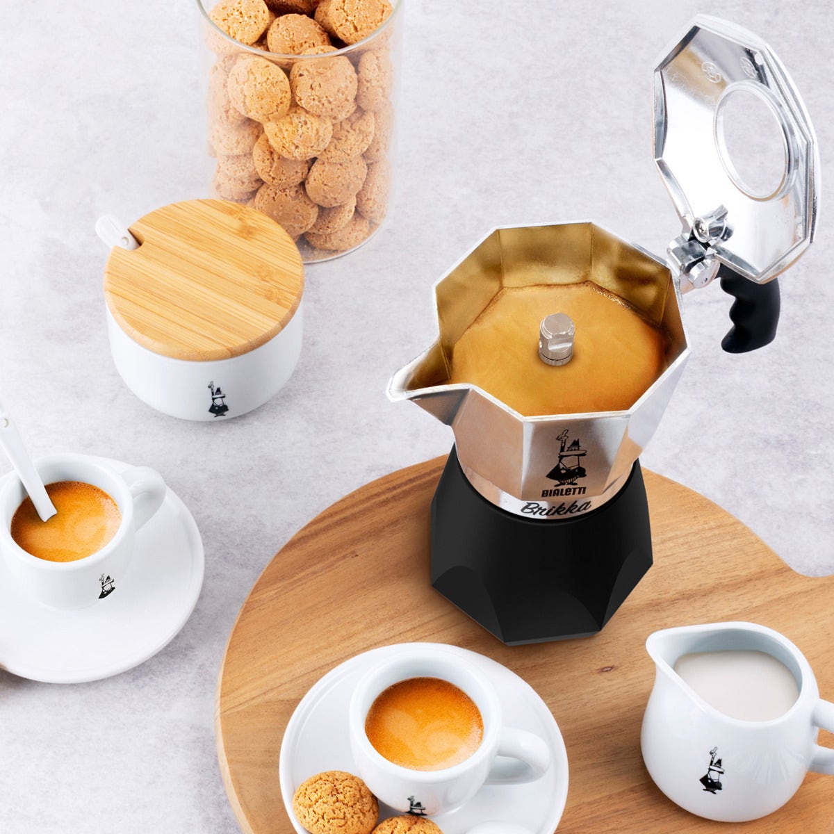 Black and stainless steel Moka pot with brewed coffee in it
