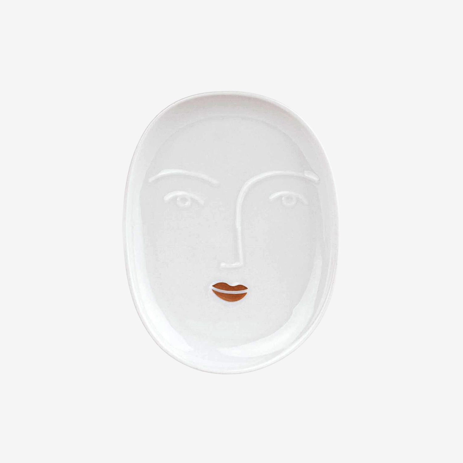 White ceramic face-shaped plate with a stylized face design on a white background